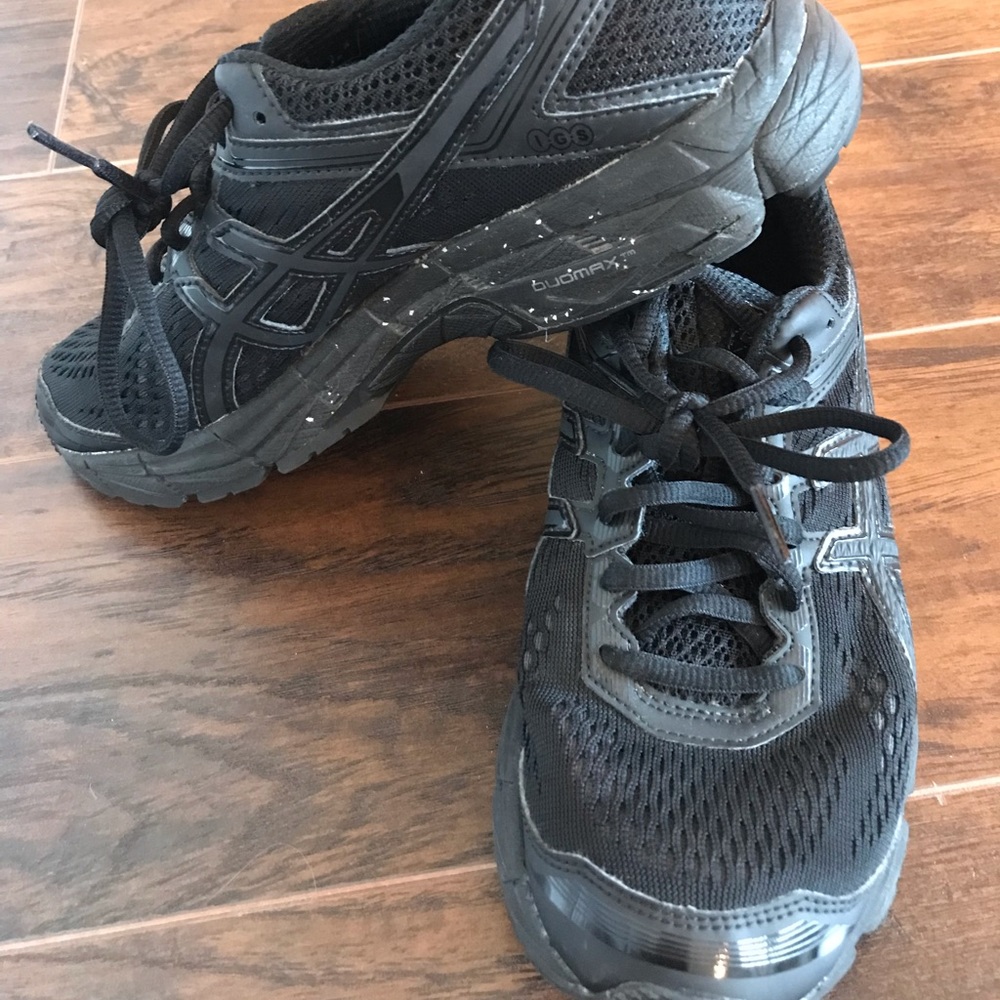 All black ASICS running shoes